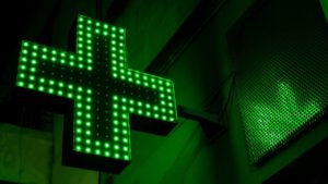 green and white x sign